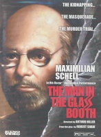 Man In Glass Booth Photo