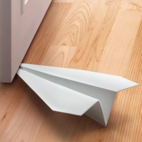 Photo of Fred Friends Last Stop Paper Airplane Doorstop