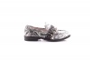 Women's black and white leather loafer Photo